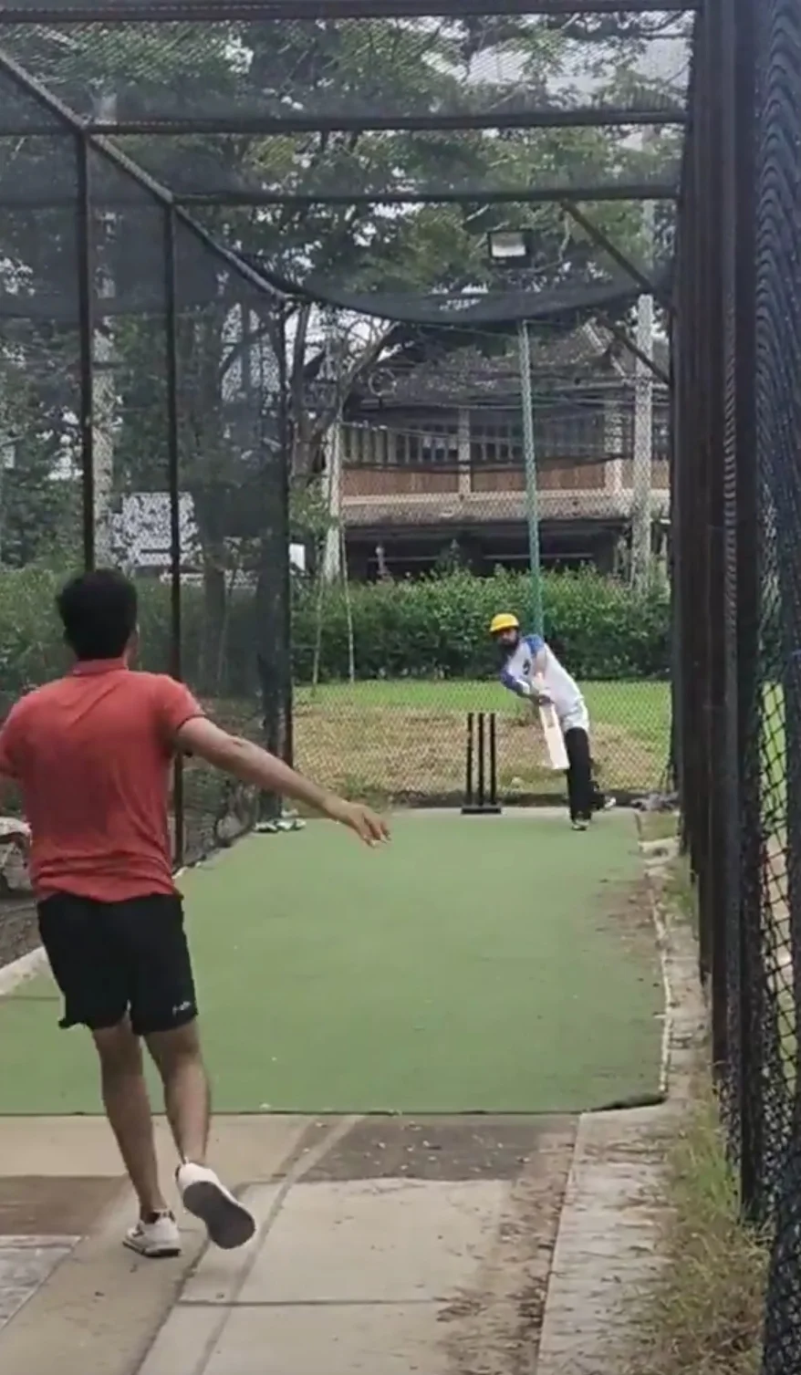Batsman at the cricket nets during batting practice at Chiang Mai Gymkhana Club