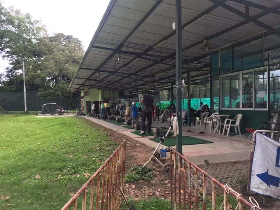 Golf driving range with covered practice bays at Chiang Mai Gymkhana Club
