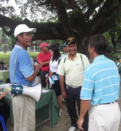 Golf tournament registration with a megaphone announcement at Chiang Mai Gymkhana Club