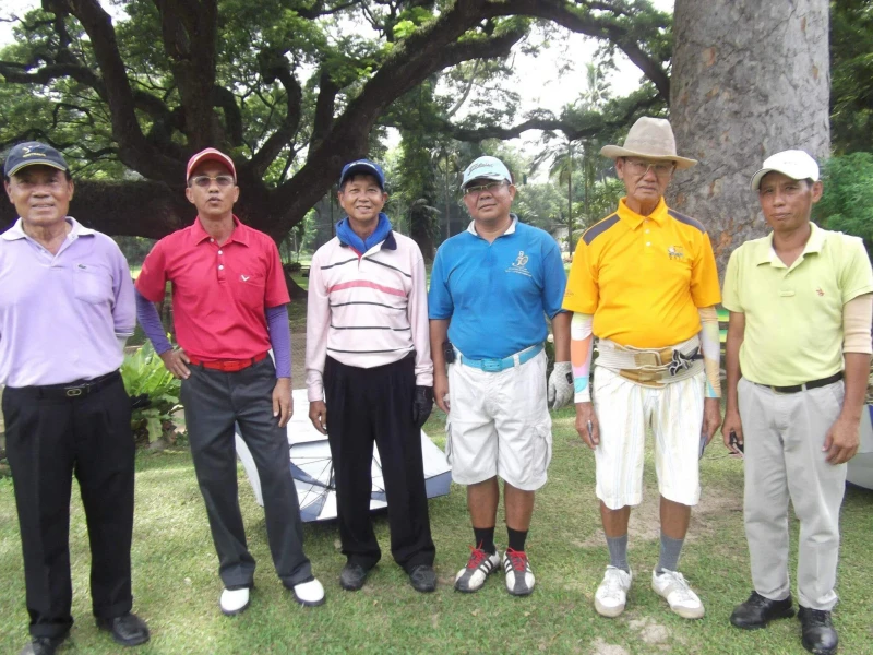 Six golfers posing for a group photo on the Chiang Mai Gymkhana Club golf course