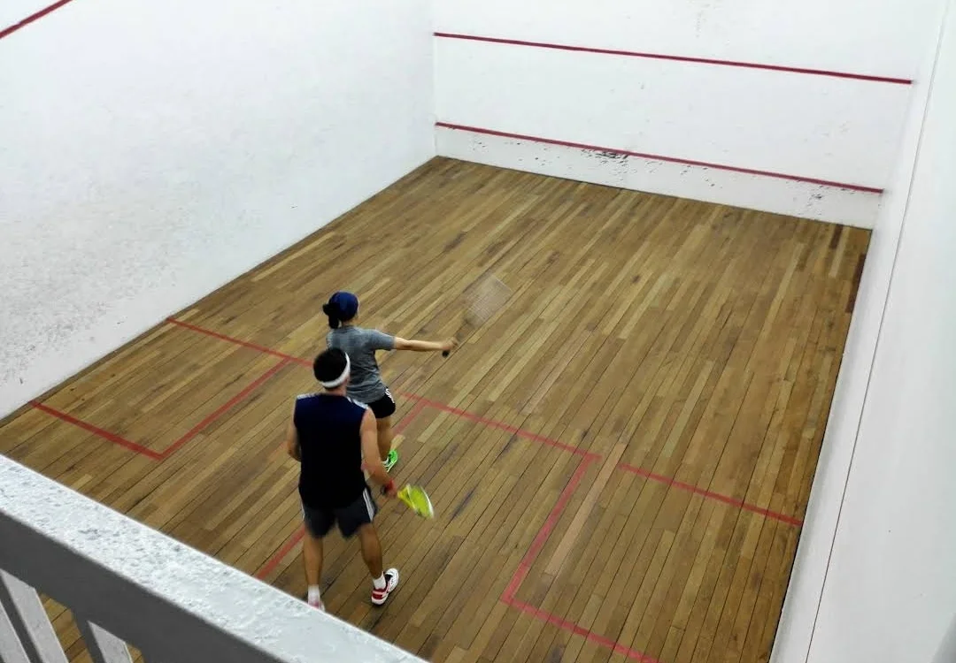 Two players on Gymkhana squash court